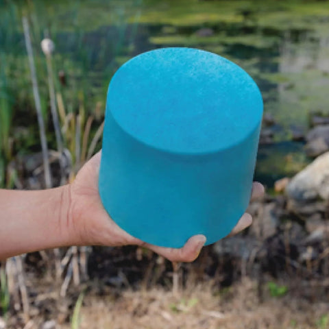 Pond Probiotics Close-Up View Of A Hand Holding Muck Block