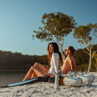 Thumbnail for Propulsion Device With A Man and Woman Sitting by the Sea with the Device