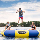 Rave Sports Aqua Jump Water Trampoline With Two Girls Sitting And A Man Jumping