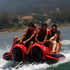 Thumbnail for Red Shark 10 Person Banana Boat With Group Of Men Held On Tightly While Riding And Facing The Strong Waves