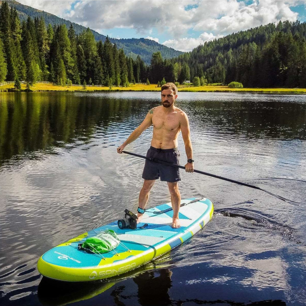 SUP Spinera Sun Light 11 0 With a Man Gliding on Calm Water