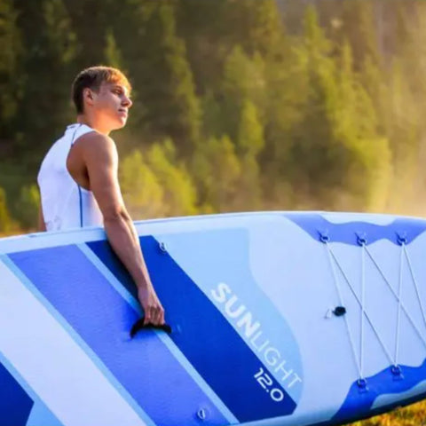 SUP Spinera Sun Light 12 0 With A Man Carrying Near Forest