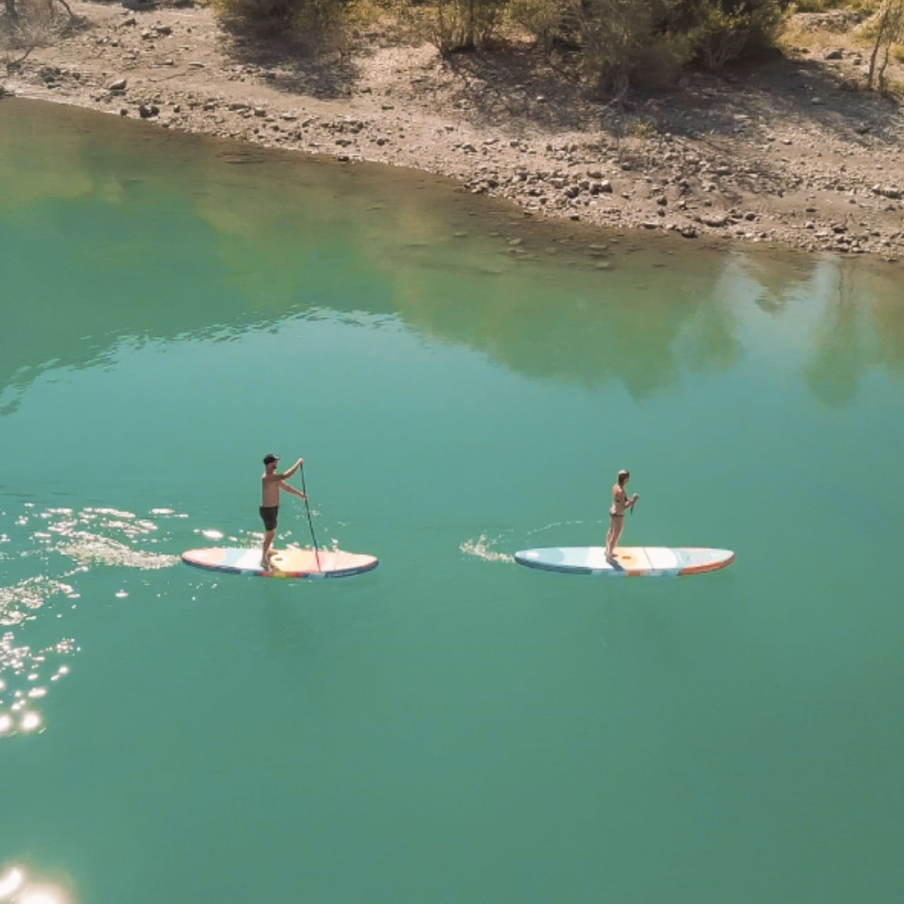 SUP Spinera Supventure Sunset 10.6 With A Couple Paddling Together on Calm Water