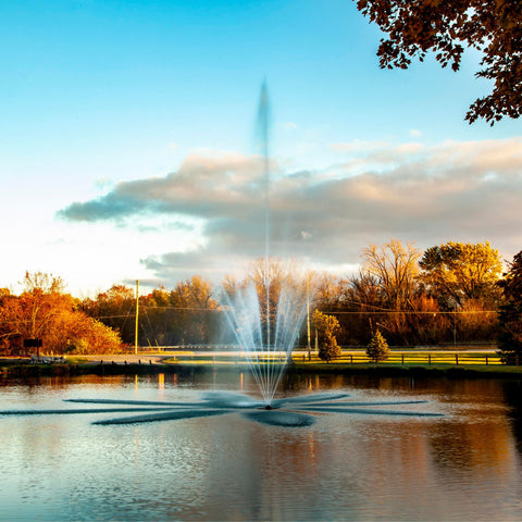 Scott Aerator Atriarch Pond Fountain On The Water With Colorful Trees In The Background