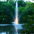 Thumbnail for Scott Aerator Clover Pond Fountain On The Water With Lights & Trees In The Background