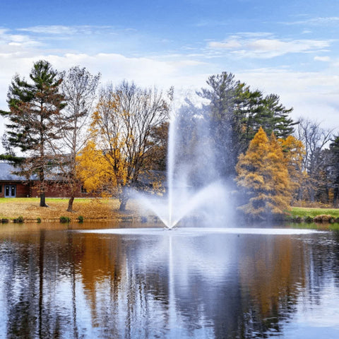 Scott Aerator Skyward Pond Fountain On The Water With Colorful Trees In The Background
