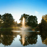Thumbnail for Scott Aerator Skyward Pond Fountain On The Water With Green Trees In The Background