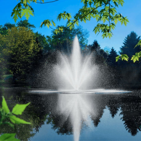 Scott Aerator Cambridge Pond Fountain On The Water With Blue Sky & Green Trees In The Background
