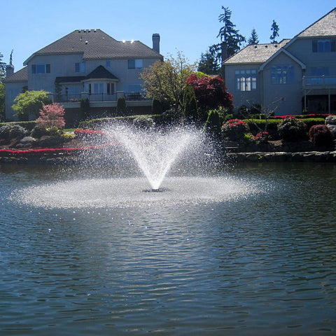 Scott Aerator DA-20 Solar Pond Aerator Fountain On The Water With Houses In The Background