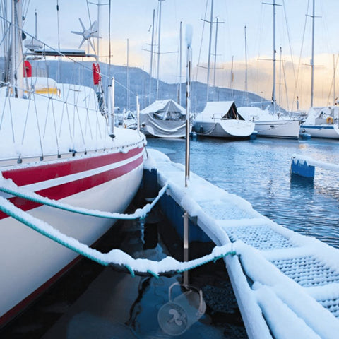 Scott Aerator Pond De-Icer In The Water Next To A Boat