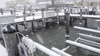Thumbnail for Scott Aerator Pond De-Icer In The Water Next To A Dock With Snow