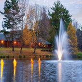 Scott Amherst Nozzle With A Lighted Colorful Scenic View And A Big House In The Background