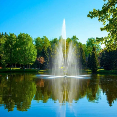 Scott Clover Nozzle With Blue Clear Sky Reflected On The Water And Surrounded By Green Trees