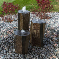 Thumbnail for Semi-Polished Basalt Rock Column Fountain With Grassy And Shrubbery Background