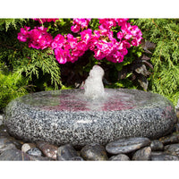 Thumbnail for Smooth Round Granite Stone Fountain With Vibrant Flowers And Shrubs Behind