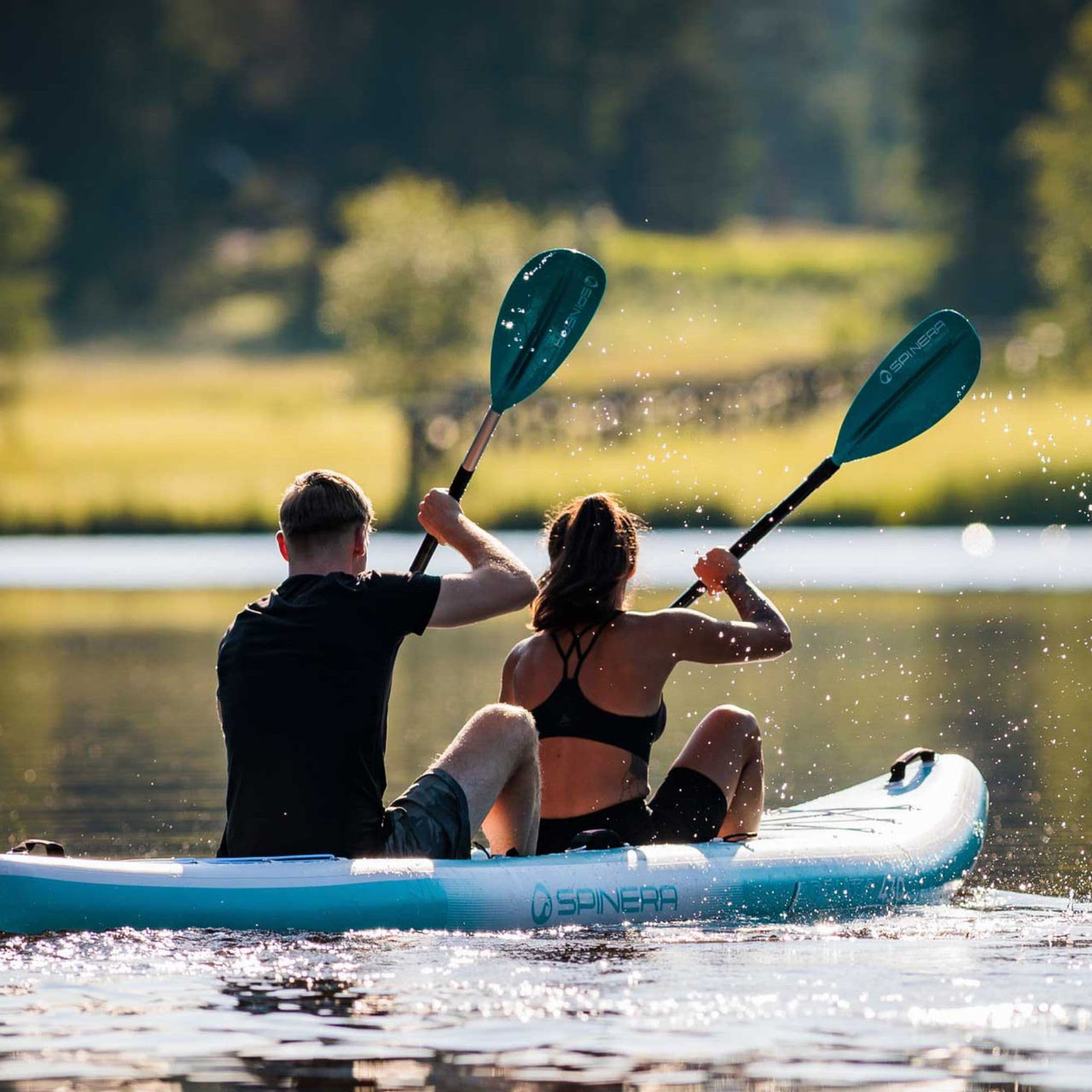 Spinera Adriatic 430 Inflatable Kayak With A Couple Paddling Together On Peaceful Lake