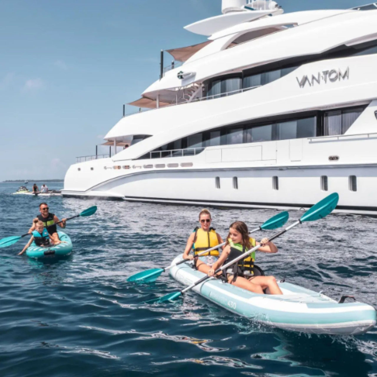 Spinera Adriatic 430 Inflatable Kayak With A Family Kayaking Beside Luxury Yacht On Open Sea