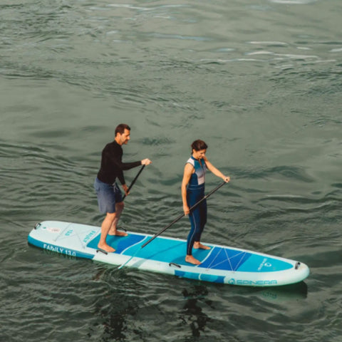 Spinera Family 13.0 Paddle Board With A Man and Woman Paddling Together on Open Water