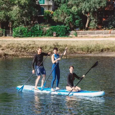 Spinera Family SUP 13.0 With Three People Paddling Together On Calm Water