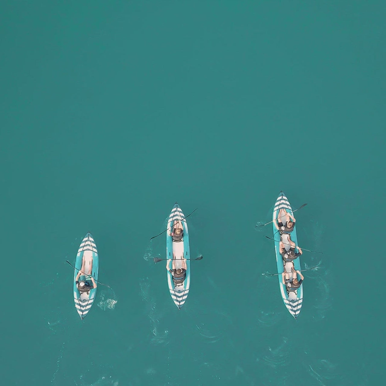 Spinera Hybris 320 Inflatable Kayak Top View Of A Group Kayaking On Blue Waters