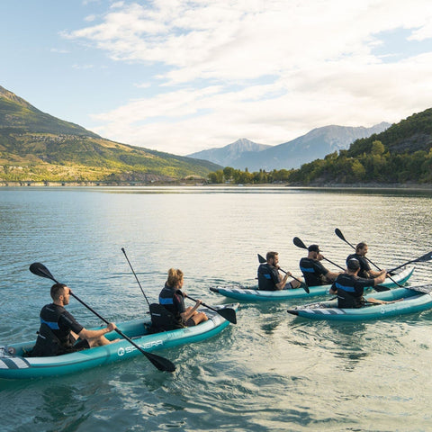 Spinera Hybris 320 Inflatable Kayak With A Group Kayaking On Beautiful Landscape Surrounded