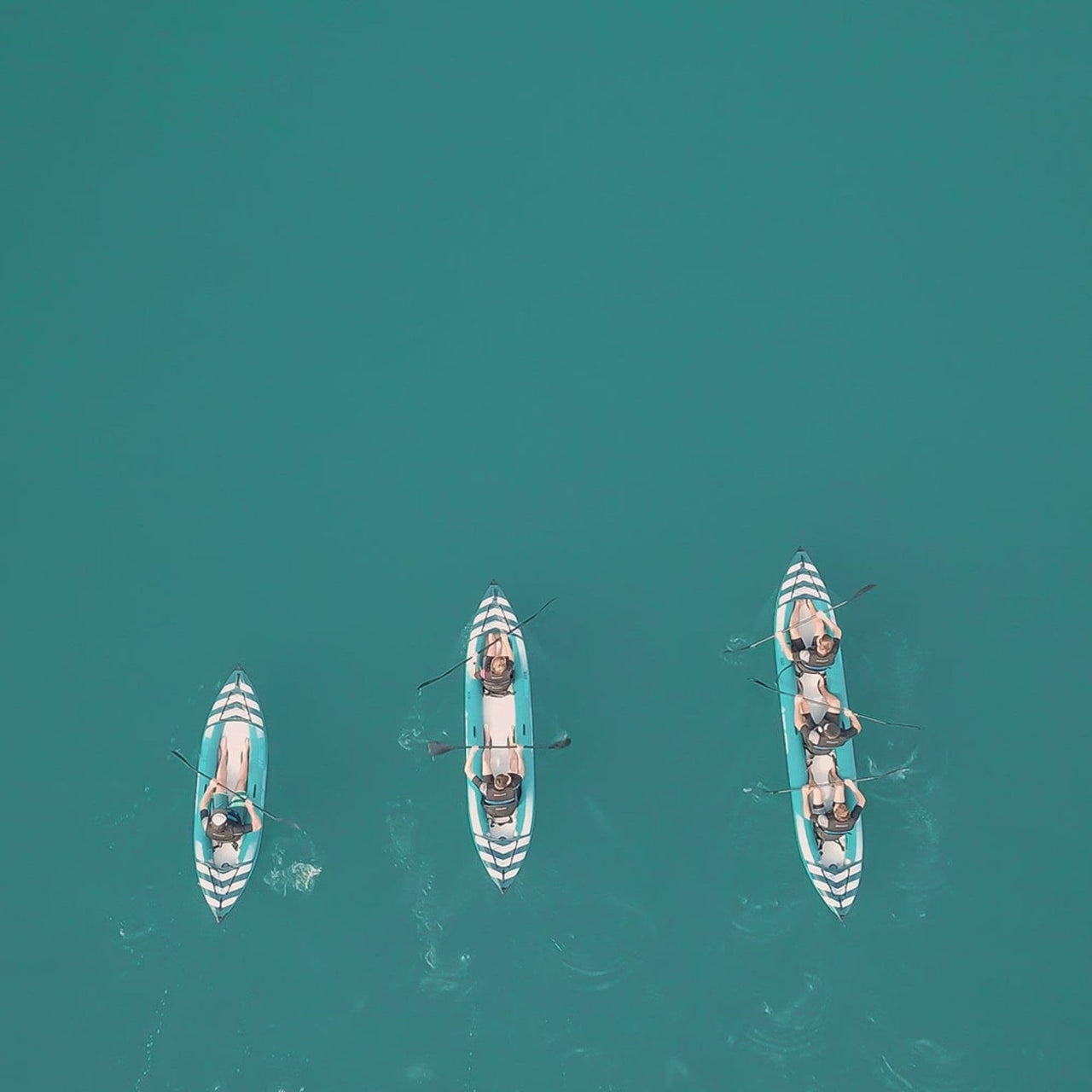 Spinera Hybris 410 Inflatable Kayak Top View Of A Group Kayaking On Blue Waters