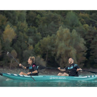 Thumbnail for Spinera Hybris 410 Inflatable Kayak With Two People Laughing While Kayaking On Calm Water With Trees Background