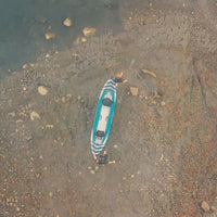 Thumbnail for Spinera Hybris 410 Top View With Two People Carrying By The Lake Shore