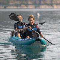 Thumbnail for Spinera Hybris 410 With Man And Women Smiling While Paddling On Calm Waters