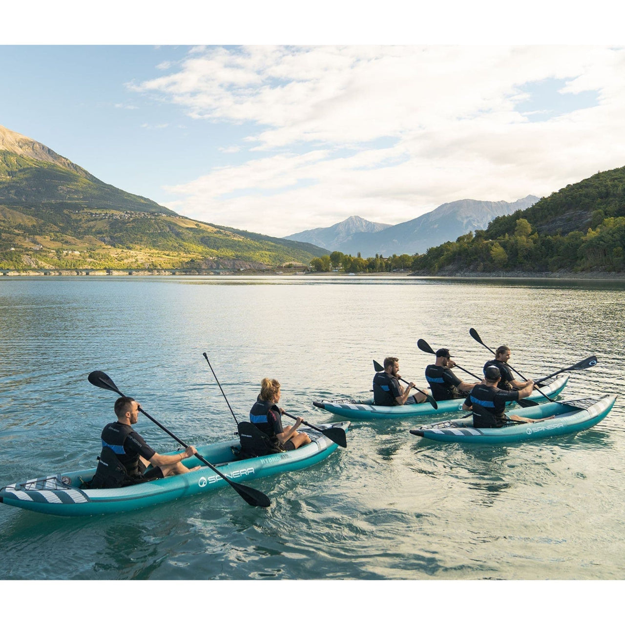 Spinera Hybris 500 With A Group Kayaking And Paddling On Calm Waters