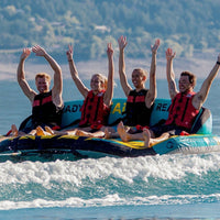 Thumbnail for Spinera Just Fun 4 Person Towable With Four People Raising Hands on Water Ride