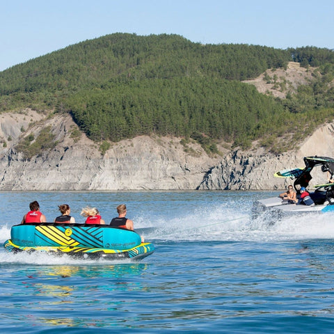 Spinera Just Fun 4 With Riders Enjoying the Ride While Boat Towing Tube