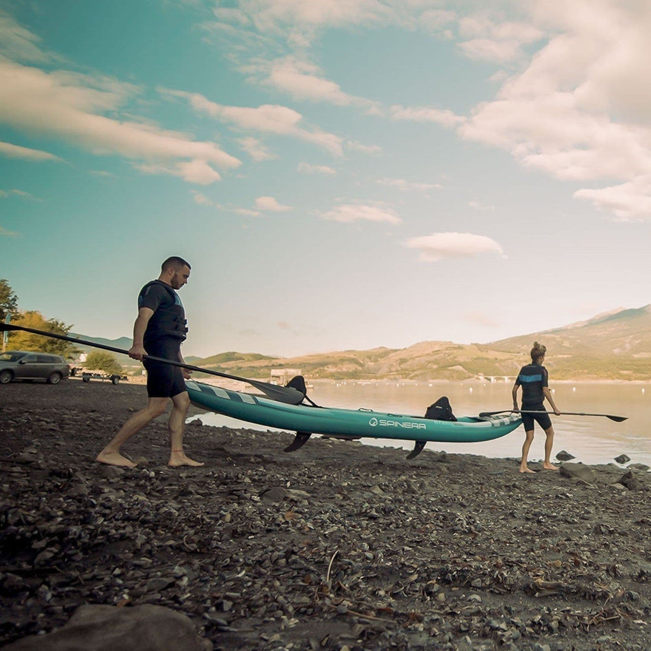 Spinera Kayak Hybris 410 With A Man And Woman Carrying Ready For Kayaking
