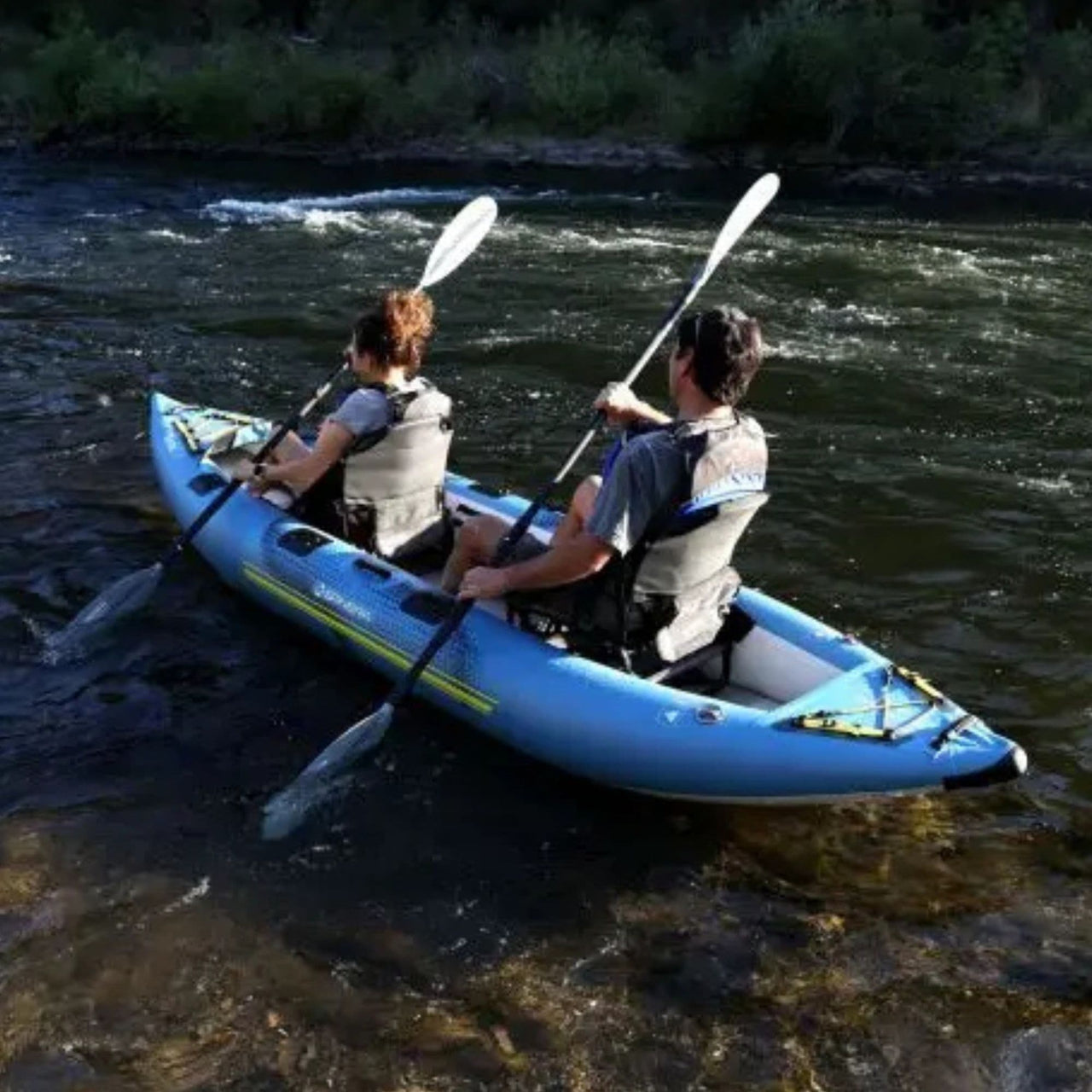 Spinera Kenai 130 With A Couple Kayaking Together On Fast-Flowing River