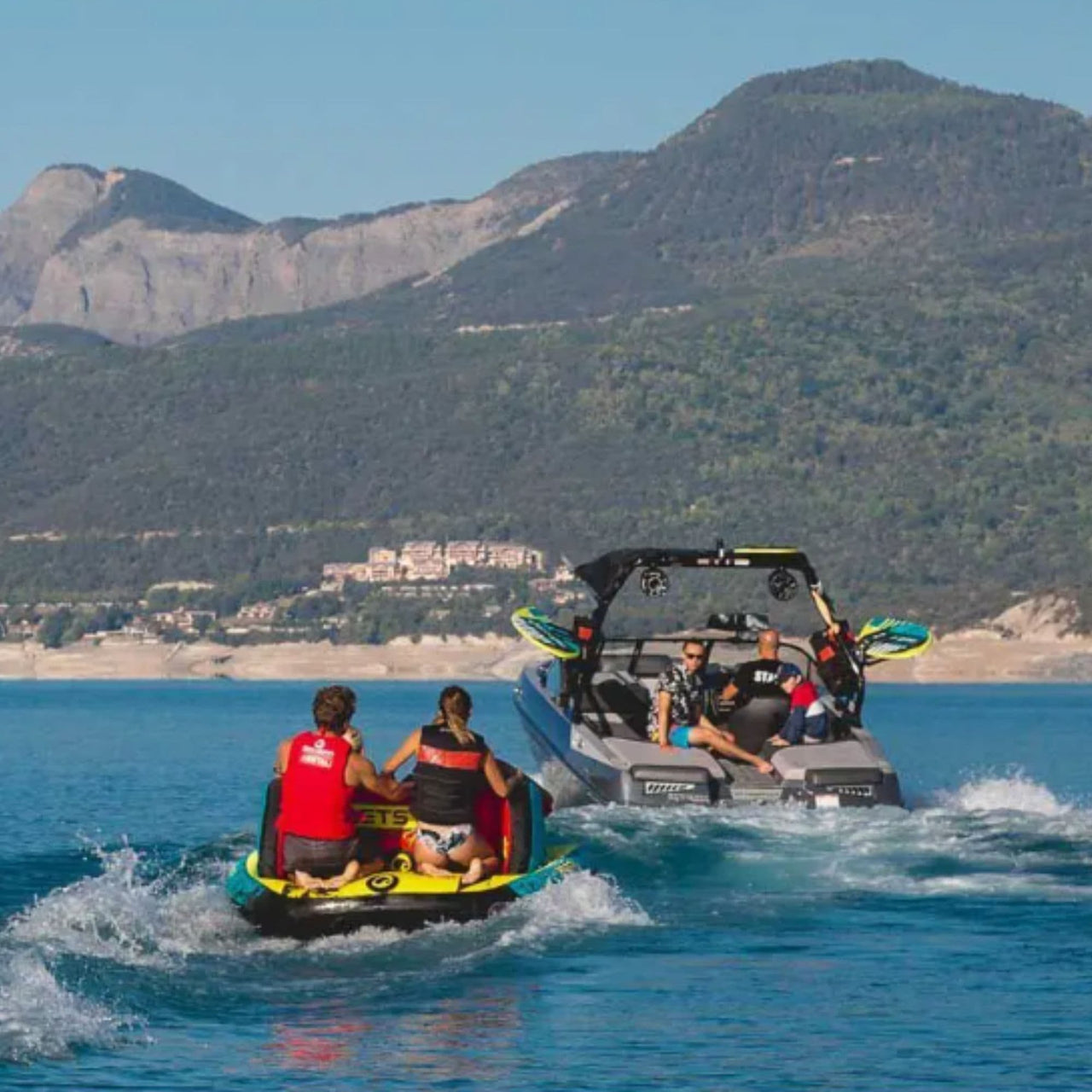 Spinera Lets Go Family 4 With Two People Riding and Pulled By Boat