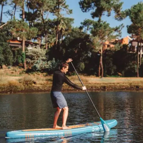 Spinera Lets Paddle 11.6 With A Man Paddling on Calm Water