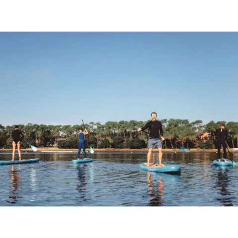 Spinera Lets Paddle 11 6 Paddle Board With A Group of People Padding Together