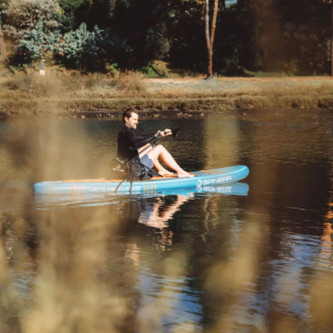 Spinera Lets Paddle 12.4 Paddle Board With a Man Paddling On Calm Lake