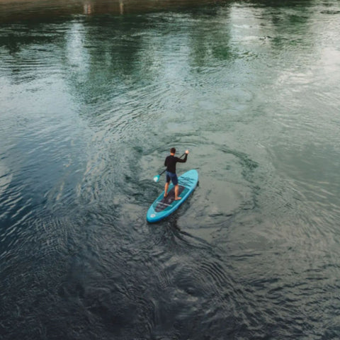 Spinera Lets Paddle 12.4 With a Woman Paddling On Open Water