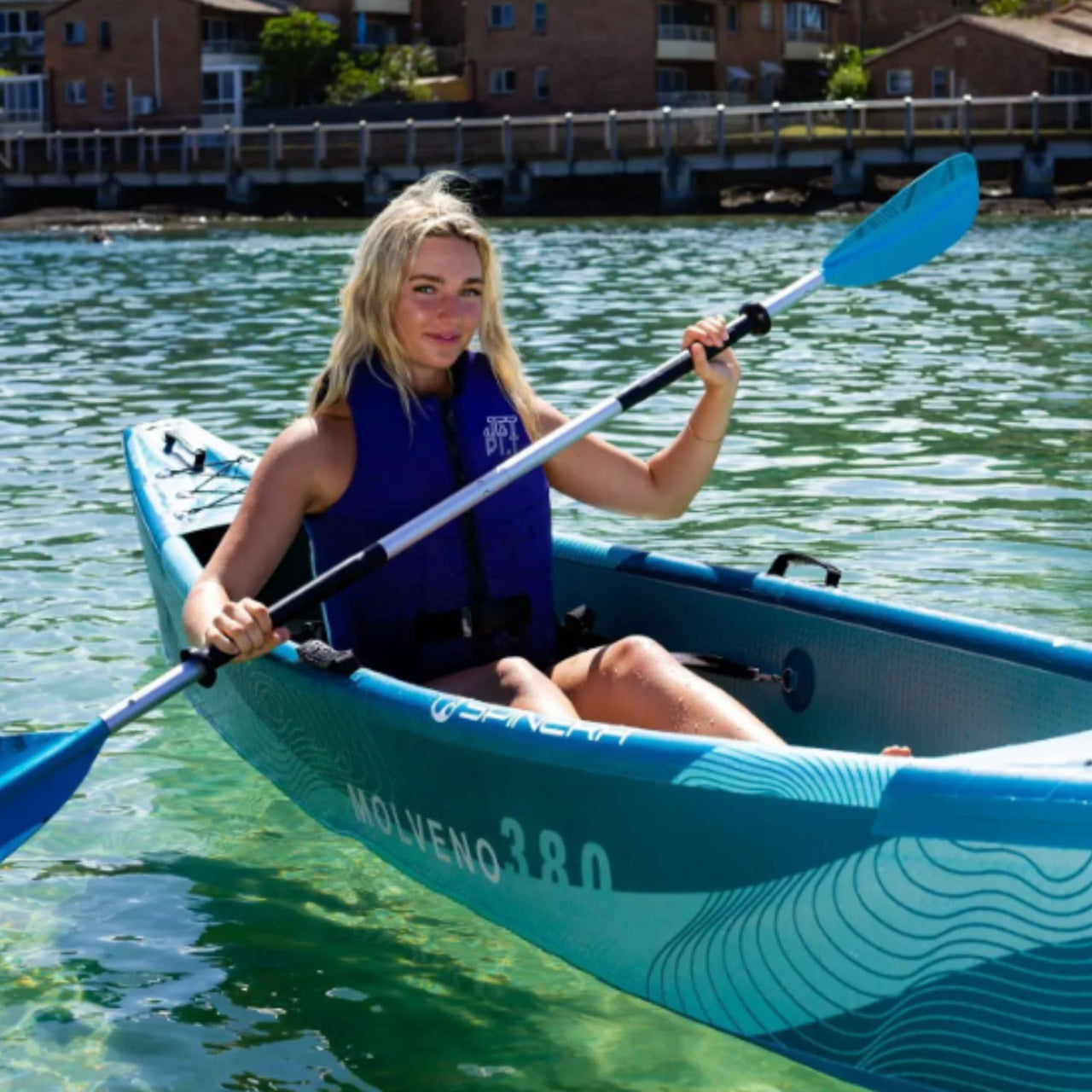 Spinera Molveno 380 Inflatable Kayak With A Girl Kayaking In Clear Blue Water