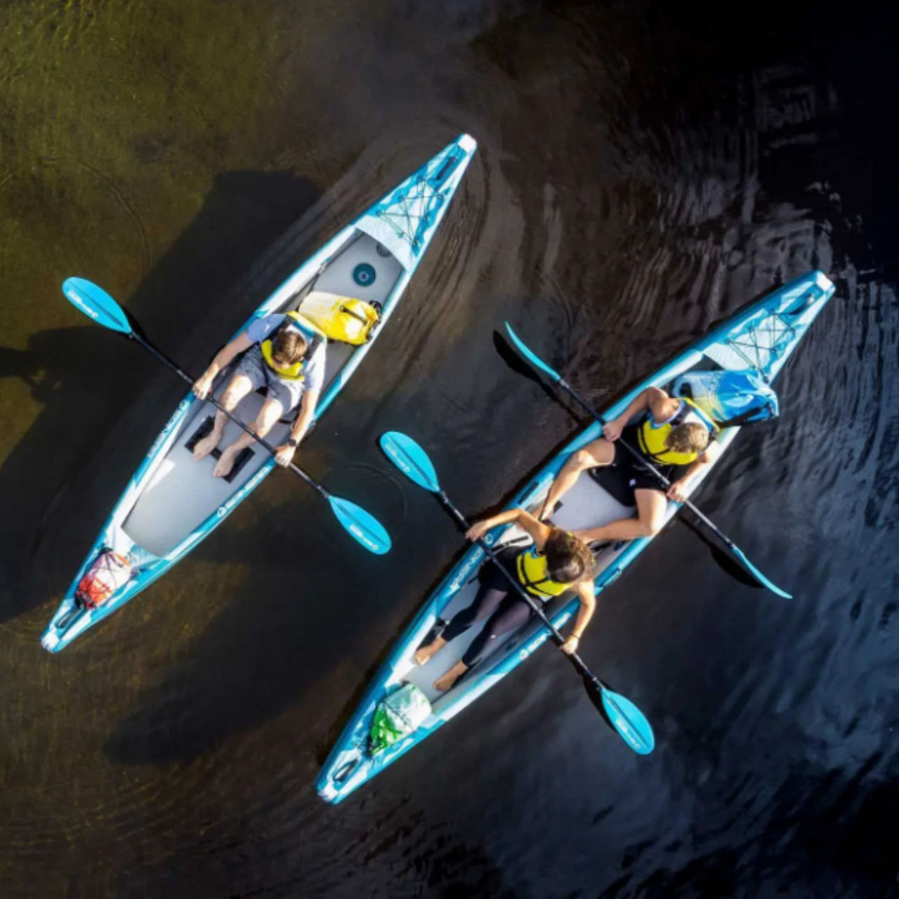 Spinera Molveno 380 Overhead View With People Paddling On Dark Water