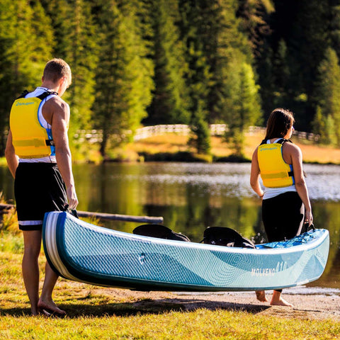 Spinera Molveno 410 Inflatable Kayak With A Couple Carrying And Getting Ready For Kayaking By Lake