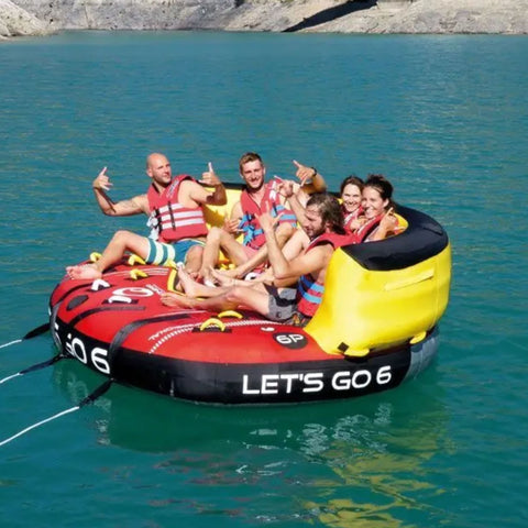 Spinera Professional Lets Go 6 Person Towable Six Riders Ready For A Ride On Calm Blue Water