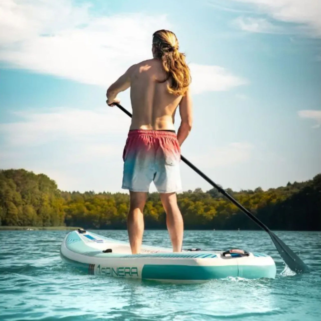 Spinera SK10 SUP Kayak With a Man Paddling on Clear Blue Water