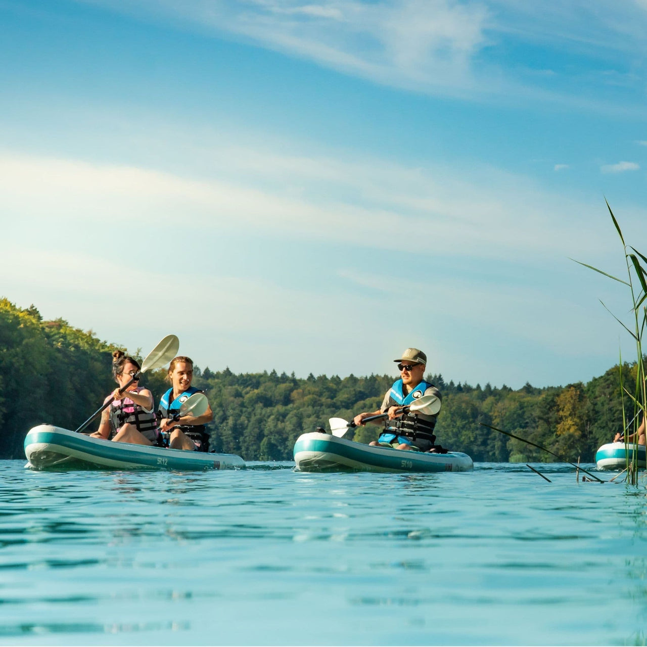 Spinera SK10 With a Group of Three Kayaking Together on Lake