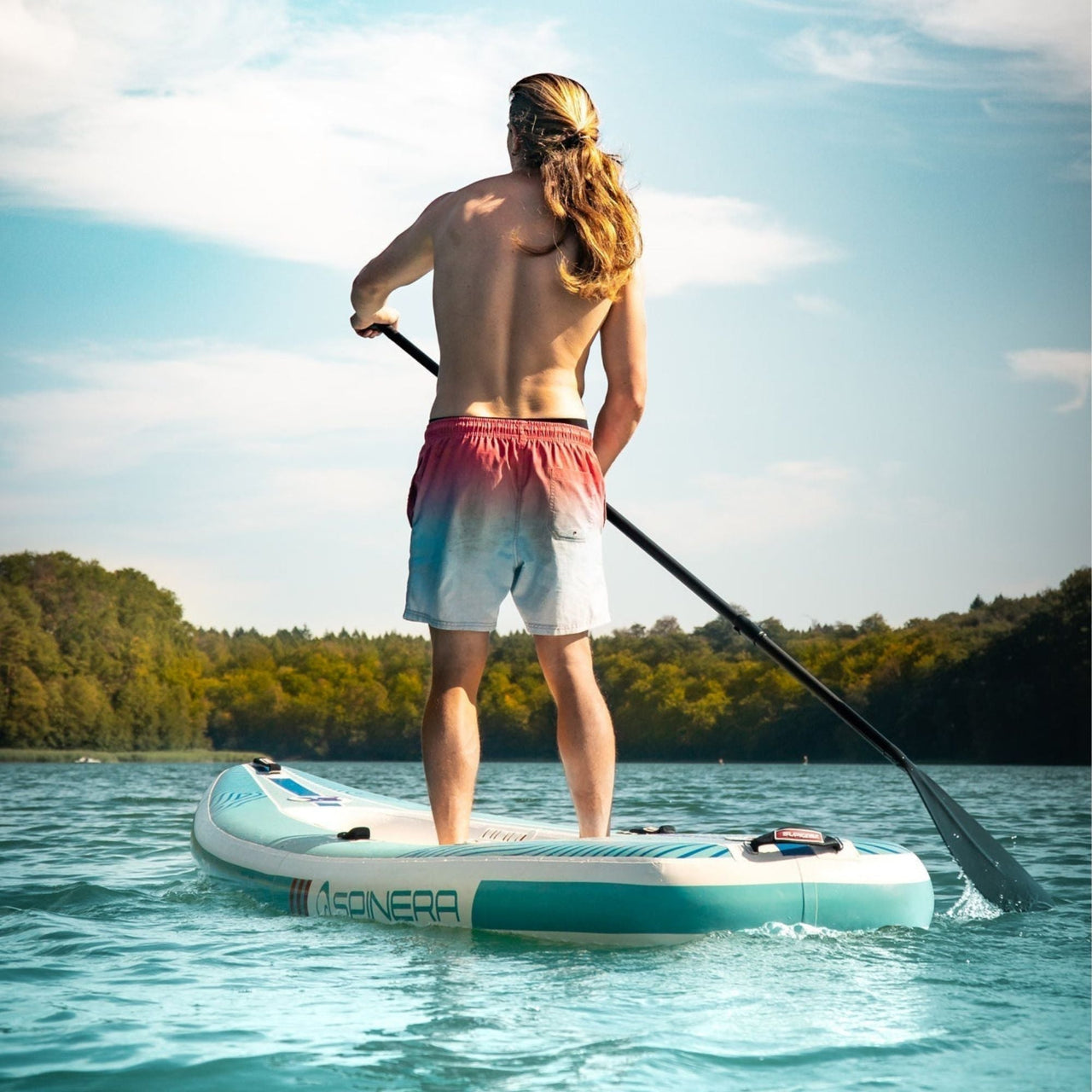 Spinera SK12 SUP Kayak With A Man Standing While Paddling