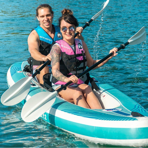 Spinera SK12 SUP Kayak With A Man and Woman Kayaking On Calm Blue Water