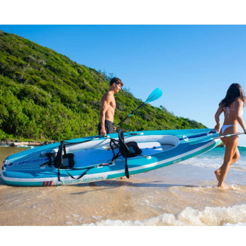 Spinera SK12 SUP Kayak With a Couple Carrying Into Ocean