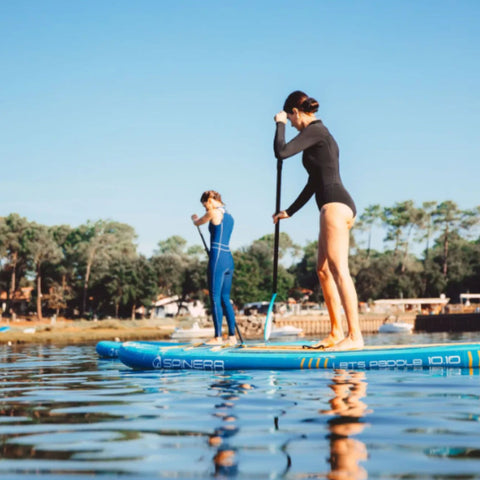 Spinera SUP 10.10 With Two Girls Paddling Together Near Lake Shore