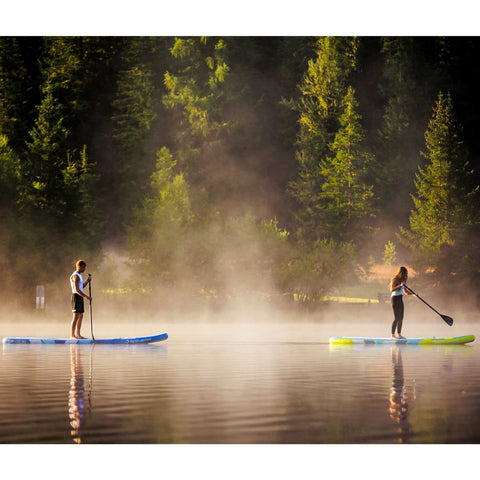 Spinera SUP Sun Light 10.2 With a Man and Woman Paddling on a Misty Lake